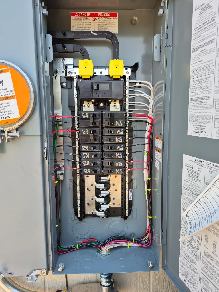 Interior of a replaced residential electrical panel with organized wiring