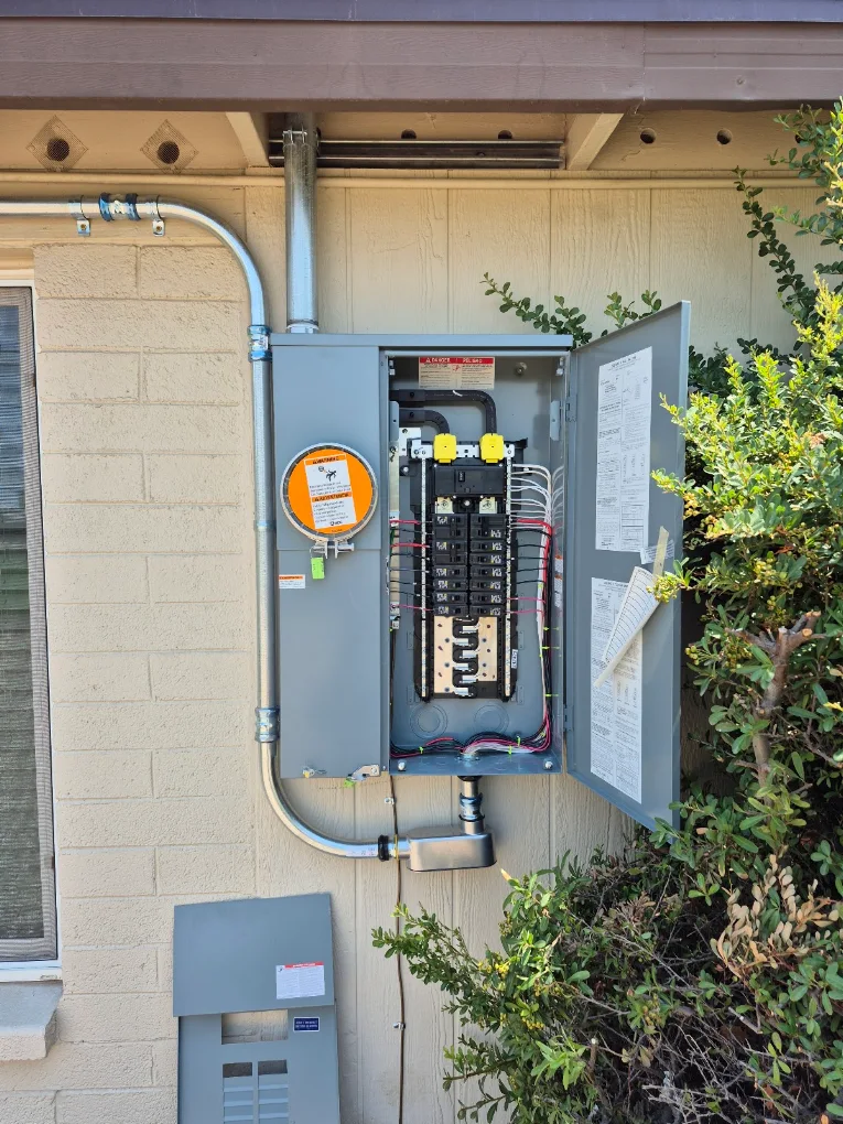 Exterior electrical service panel and meter on a home exterior wall